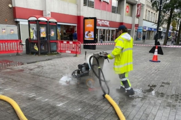 A street cleaning machine removing chewing gum in Hounslow 