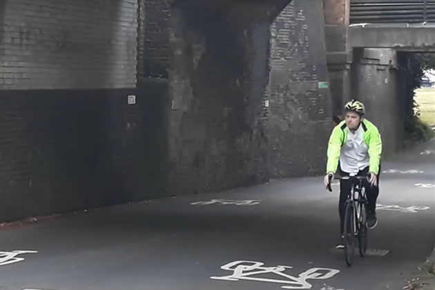 Council leader Peter Mason riding his bike 