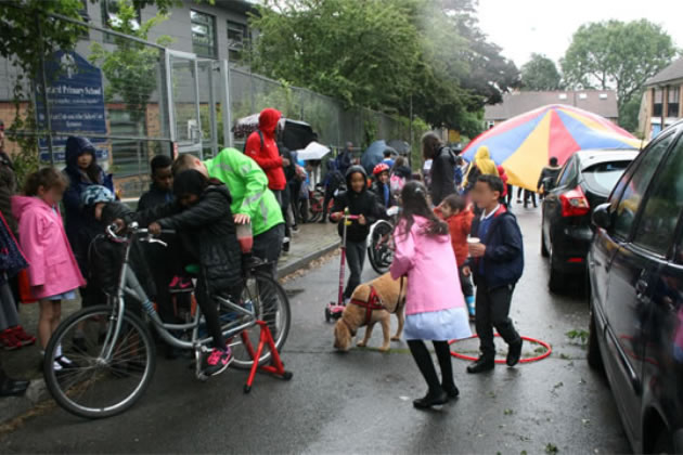 Children and parents outside Granard School in Putney 